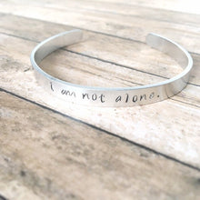 Load image into Gallery viewer, I am not alone hand stamped affirmation bangle bracelet