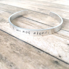 Load image into Gallery viewer, I am not alone hand stamped affirmation bangle bracelet