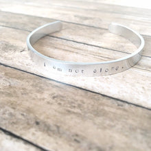 Load image into Gallery viewer, I am not alone hand stamped affirmation bangle bracelet