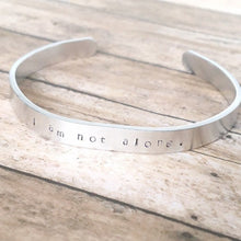 Load image into Gallery viewer, I am not alone hand stamped affirmation bangle bracelet
