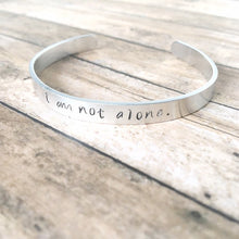 Load image into Gallery viewer, I am not alone hand stamped affirmation bangle bracelet
